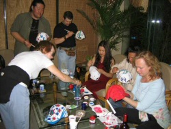 That day, after working on the sculptures, I had bought paint so we could all paint our caps in the hotel bar