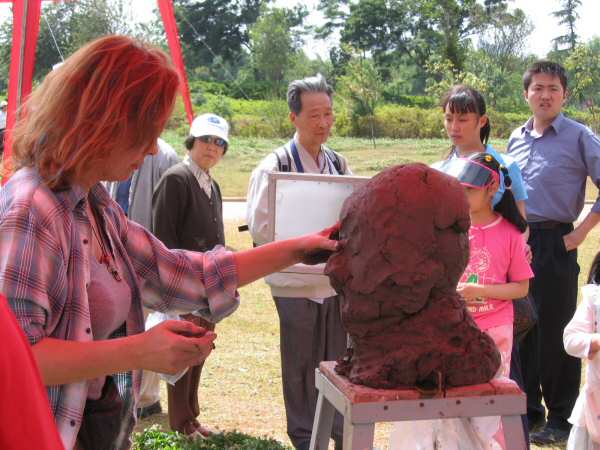 Visitors watch as I start one of the busts...