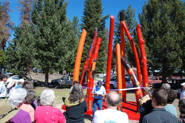 Log Henge Spirits of the Forest, this public artwork located in Seeley Lake, Montana was unveiled by Chief Victor Charlo, leader of the Salish Indian tribe, who read from his poetry book before cutting the ribbon