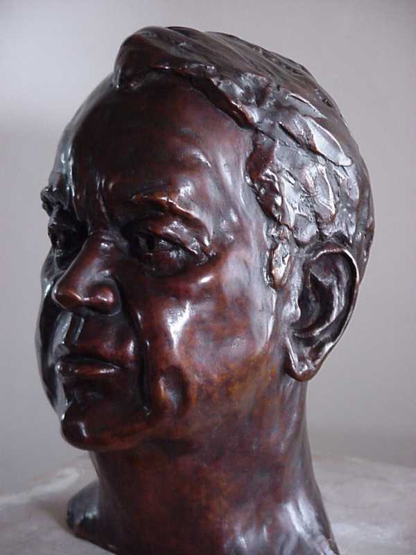 Three quarter profile view of bust of Mr George Warburton - CEO