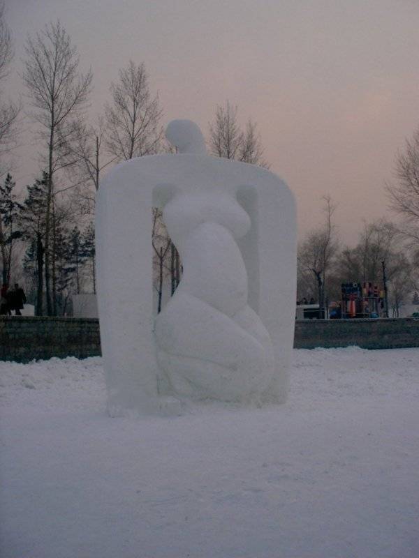 Zhang Yaxi , Bai Yuliang and Laury Dizengremel create a snow sculpture in Harbin China